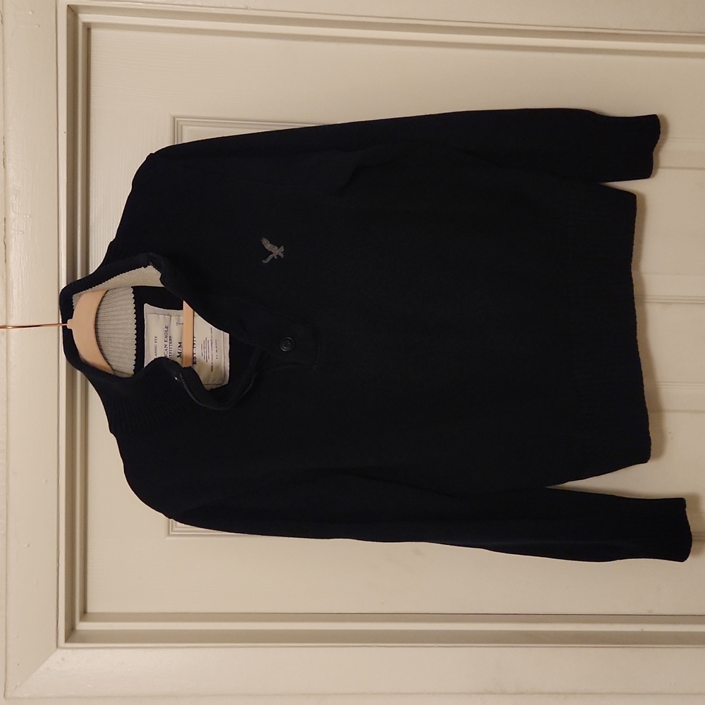 American eagle, navy colored men's sweater, small imperfection on front shown